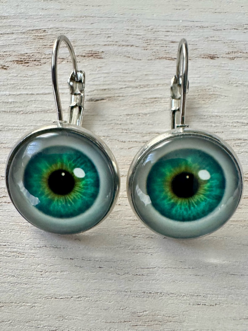 Silver Metal Green Eye Drop Earrings  about .5”